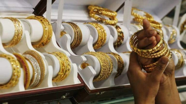 India gold prices soar to record high, dampening demand, dealers say