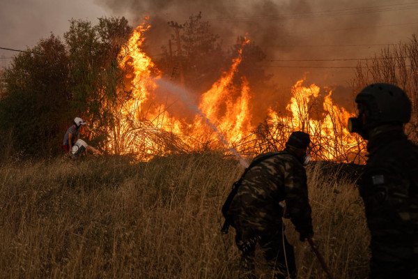 Athens wildfire kills 1 woman, destroys properties